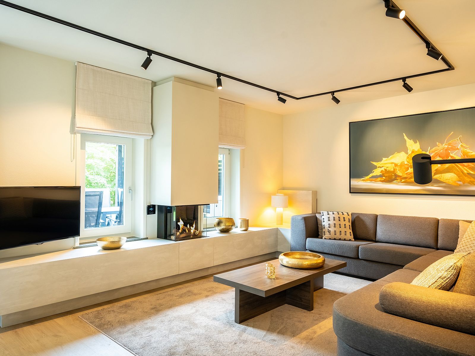 Comfortable bedroom in Hof van Saksen 8-bed farmhouse 8L, Nooitgedacht, Drenthe, with king-size bed and TV.