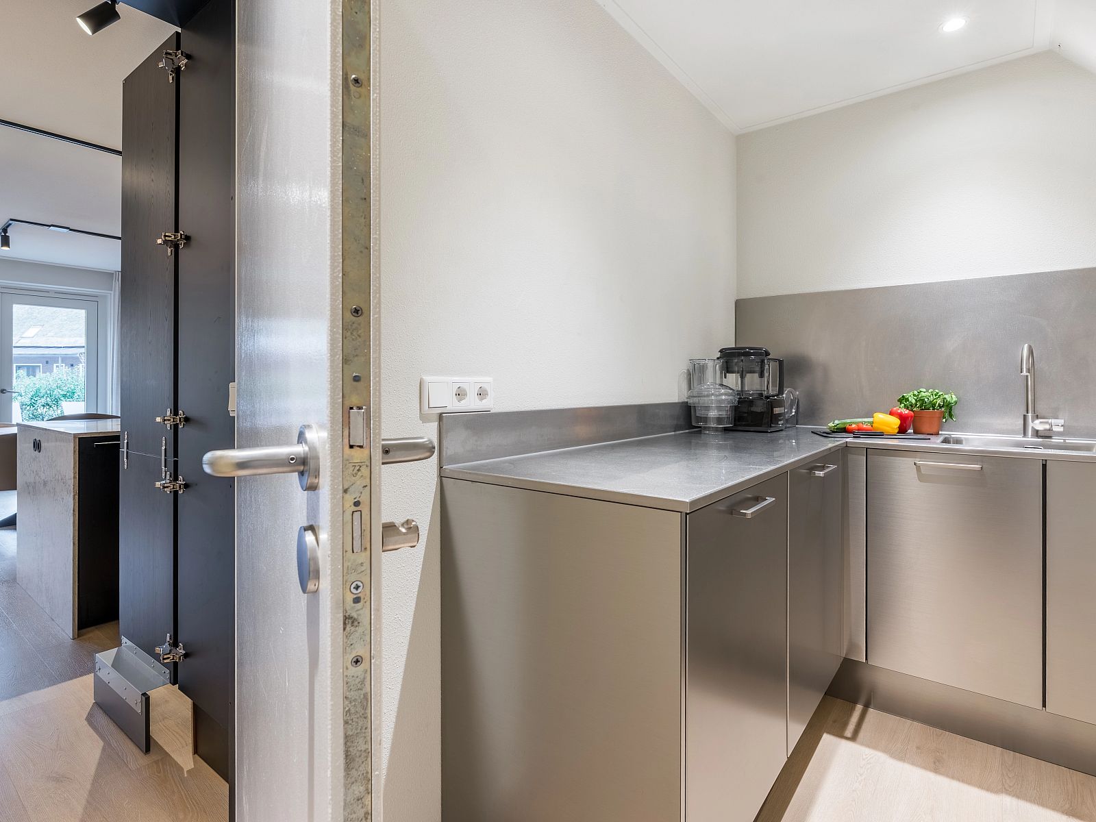 Sleek kitchen design in Hof van Saksen, 12-bed Luxury Culinary Farmhouse in Nooitgedacht, Drenthe.