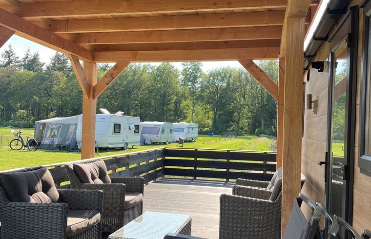 Cozy sitting area on the porch of Holiday Home in Eeserveen, Drenthe.