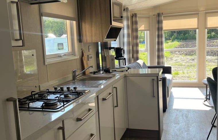 Modern kitchen in Holiday cottage in Eeserveen, Drenthe with lots of light.