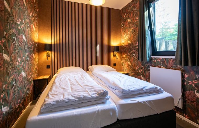 Comfortable bedroom in Cottage in Dalerveen, Southeast Drenthe with atmospheric lighting.