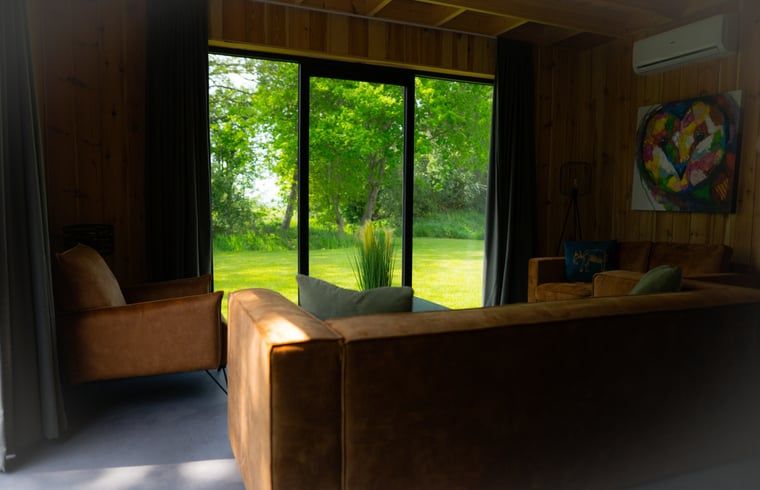 View from the living room of Holiday Home in Dalerveen, Southeast Drenthe of the surrounding nature.