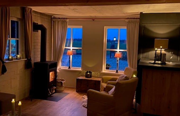 Sunny terrace at Cottage in Dalen, vacation home in Southeast Drenthe with comfortable seating.