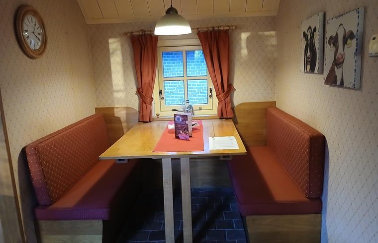 Cozy dining area in Holiday home in Stieltjeskanaal, Southeast Drenthe. Enjoy a cozy indoor space in this charming vacation home.