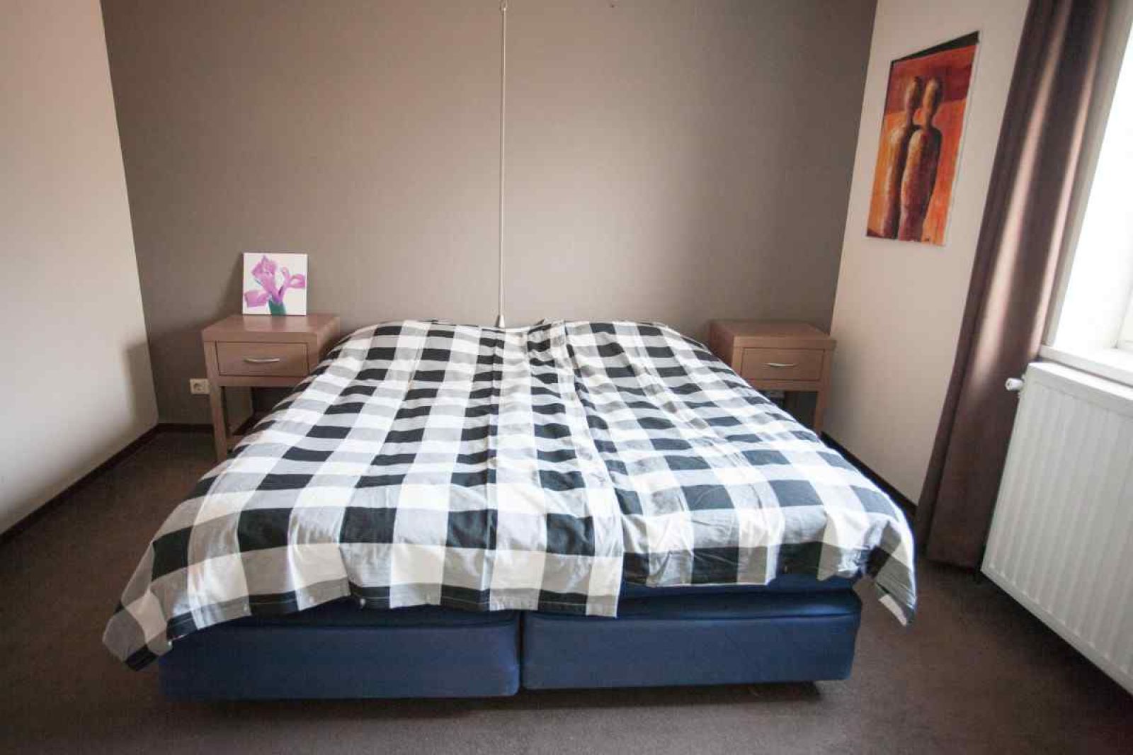 Ruime woonkamer met eethoek in vakantiehuis DG095 in Ruinen, Zuidwest Drenthe.