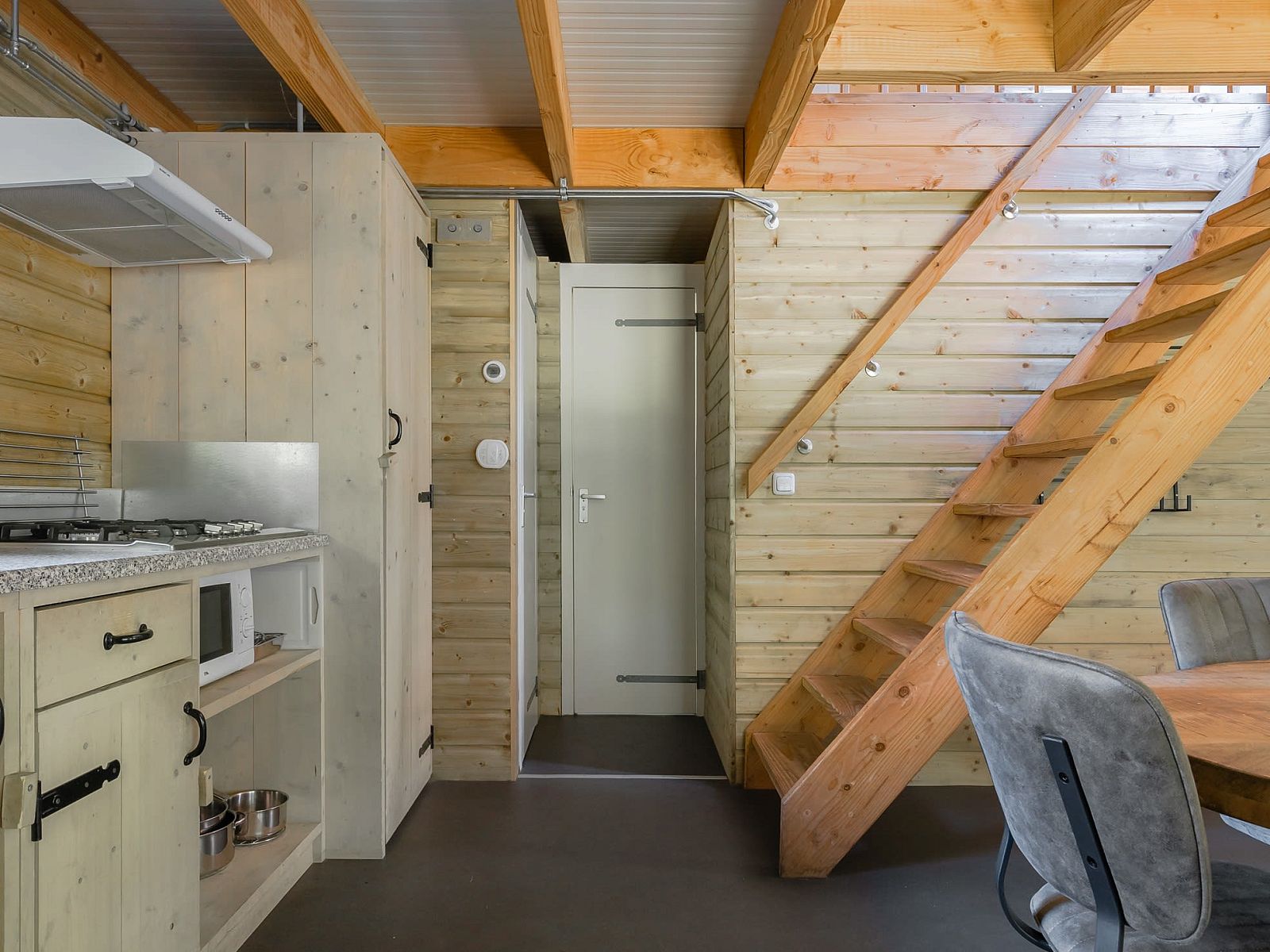 Cozy interior of Heidelodge, a vacation home in Dwingeloo, Southwest Drenthe, with wooden interior and modern amenities.