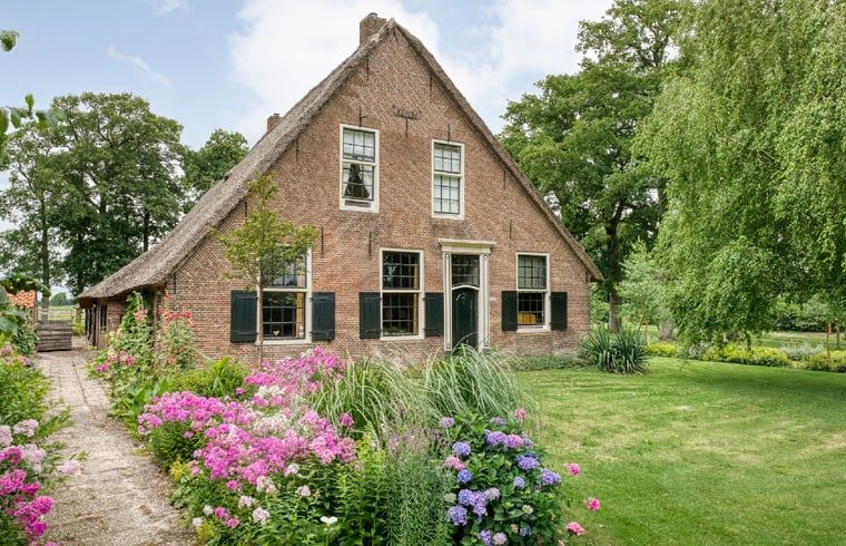 Ferienhaus in Ruinerwold, Suedwest-Drenthe, mit schoenem Garten und laendlichem Charme, ideal fuer einen entspannten Aufenthalt in der Natur.