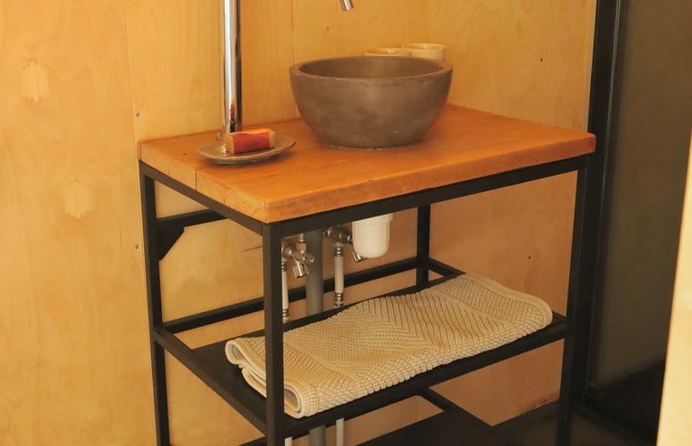 Stylish sink in Cottage in Vledder, Southwest Drenthe, with wooden details.