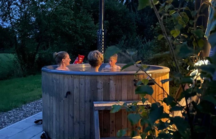 Cozy up in the hot tub at Holiday Home in Vledder, Southwest Drenthe, in the evening.