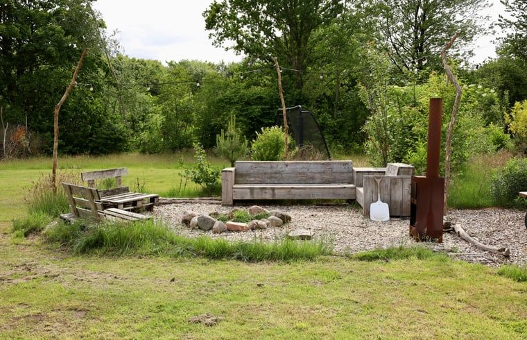 Outdoor space with sitting area and fire pit at Holiday Home in Vledder, Southwest Drenthe.