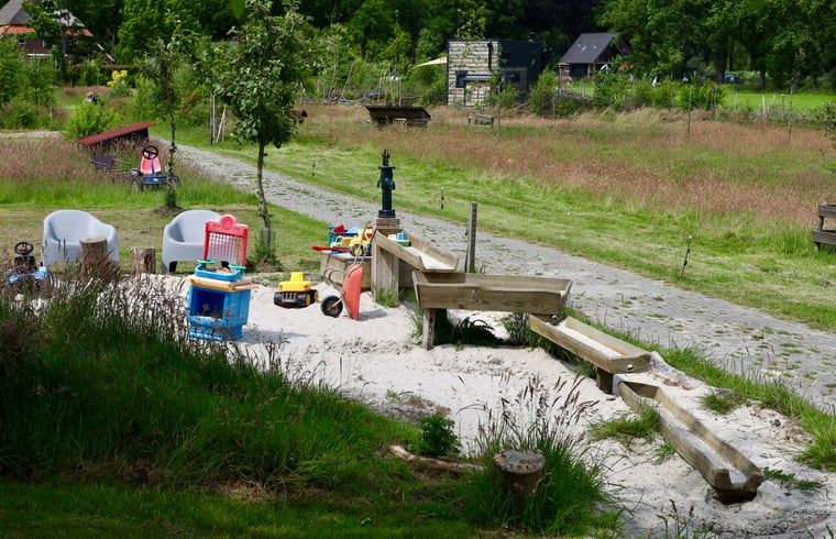 Children's playground at Holiday Home in Vledder, Southwest Drenthe, with sand and toys.