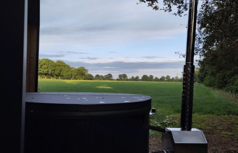 View over fields from the hot tub at Holiday Home in Vledder, Drenthe.