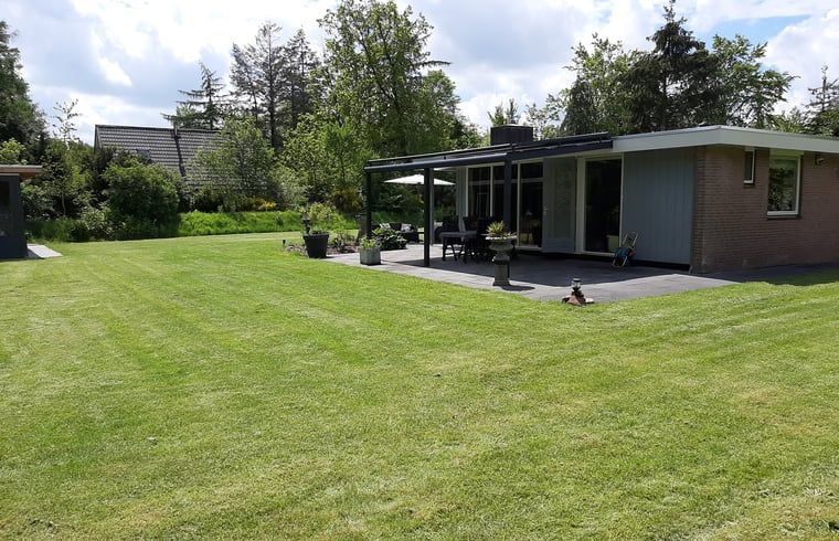Veranda of Holiday Home in Wittelte, Southwest Drenthe, with beautiful views of the garden.
