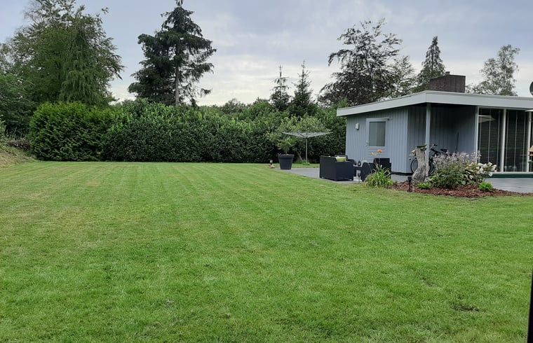 Romantic sitting area in Holiday Home in Wittelte, Southwest Drenthe, with cozy fireplace.