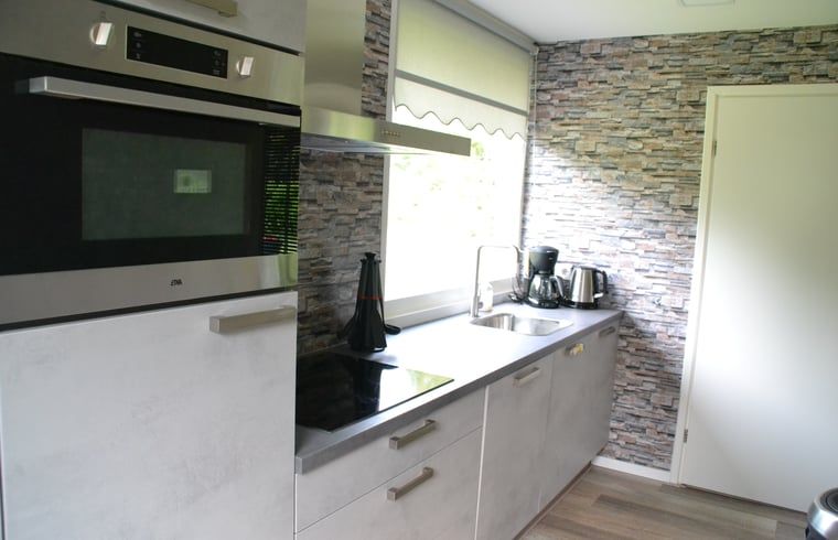 Cozy bedroom in Holiday Home in Wittelte, Southwest Drenthe, with comfortable beds.