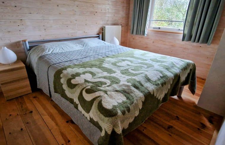 Spacious bedroom in Cottage in Koekange, vacation home in Southwest Drenthe, with comfortable bed and natural light.