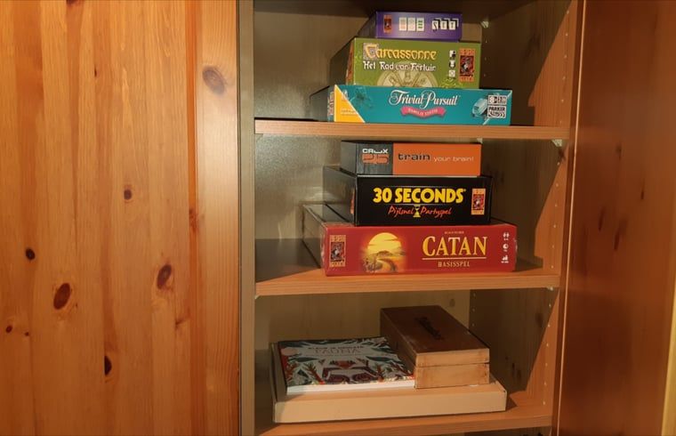 Games cupboard in Cottage in Koekange, vacation home in Southwest Drenthe, for cozy evenings with the family.