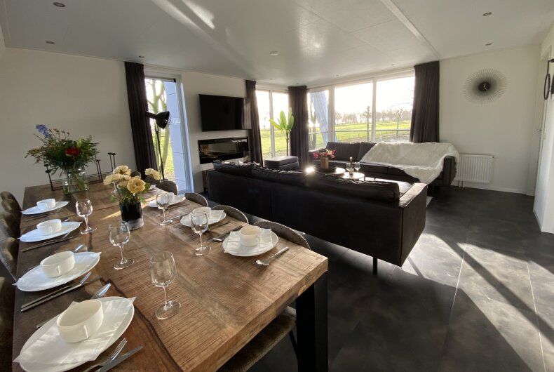 Spacious living room of detached house in Biddinghuizen, overlooking the green landscape in Eastern Flevoland, Flevoland.