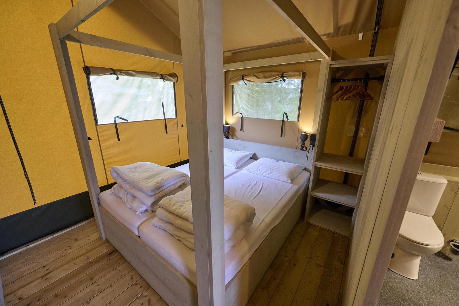 Bedroom in Safari Tent Wood, Biddinghuizen, with comfortable beds and natural light in Flevoland.