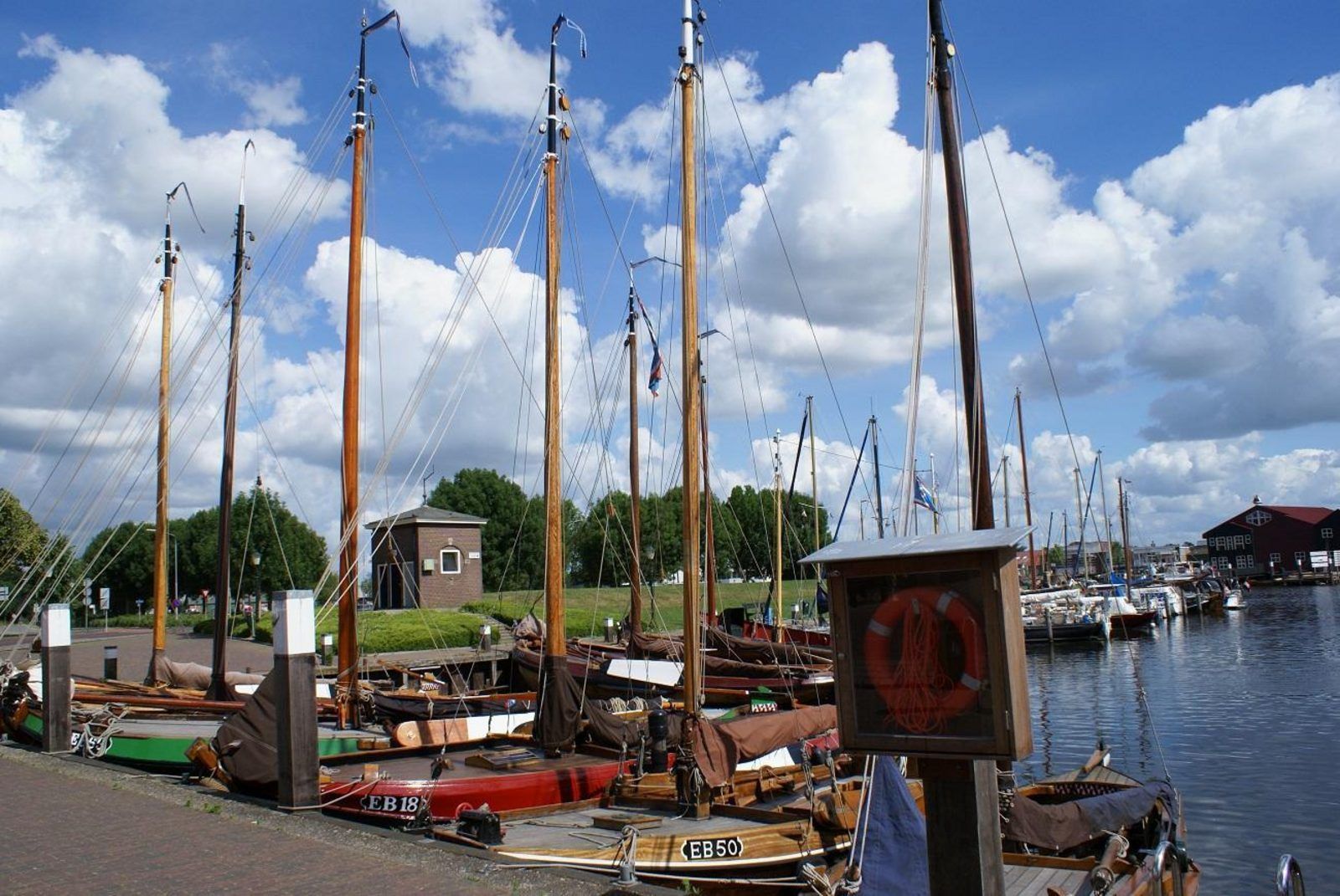 Historic harbor near Safari Tent Wood, Biddinghuizen, with traditional boats in Flevoland.