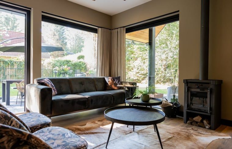 Cozy living room of Huisje in Appelscha, vacation home in the Frisian forests, overlooking the nature in Friesland.