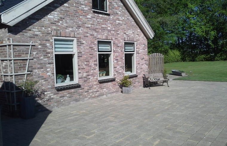 Brick facade of Holiday home in Steggerda, surrounded by Frisian forests in Friesland.