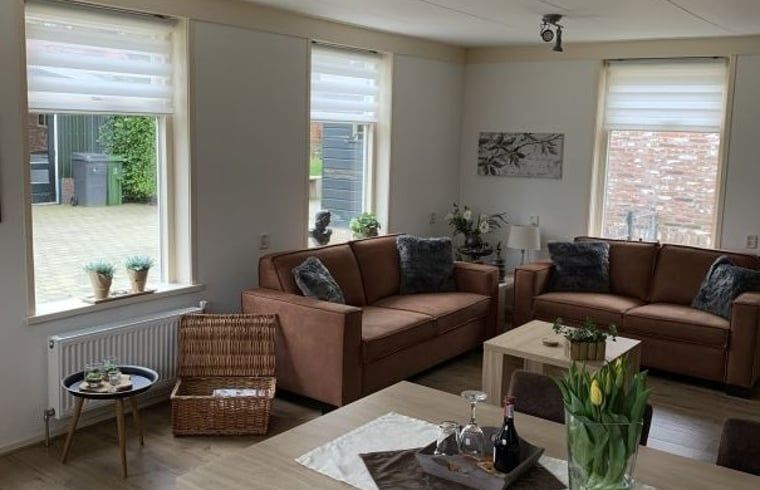 Cozy living room in Holiday home in Steggerda, surrounded by Frisian nature.