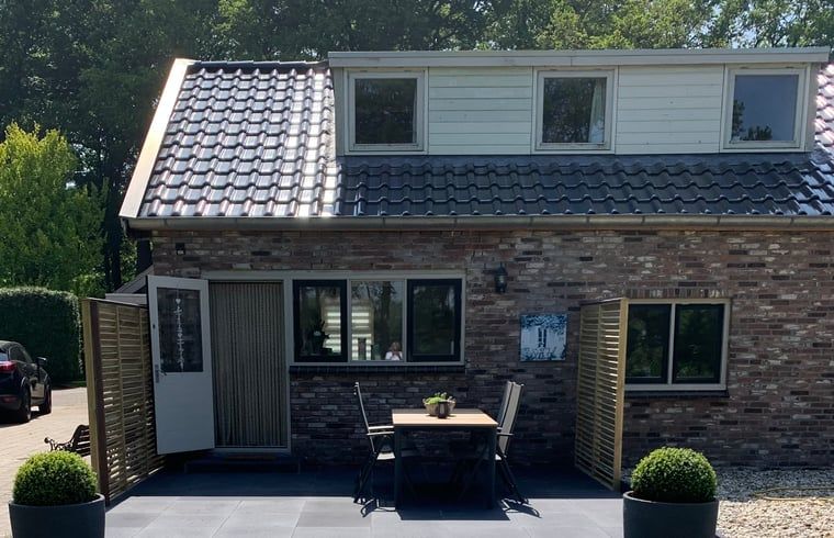 Terrace with French doors at Holiday home in Steggerda, Friesland.