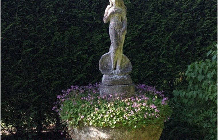 Garden sculpture in flower garden at Holiday home in Steggerda, Frisian forests.