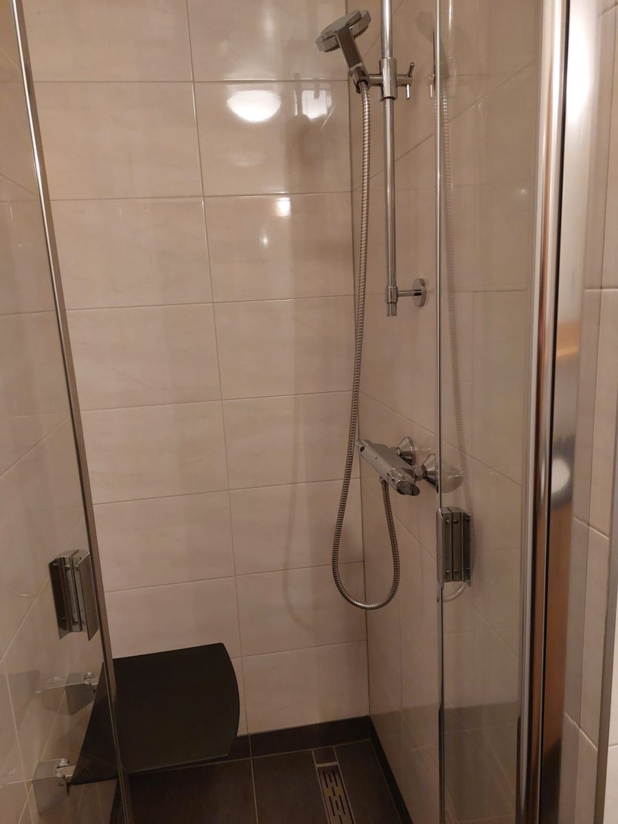 Cozy living room of vacation home FR440 in Friesland with comfortable sofa and natural light.