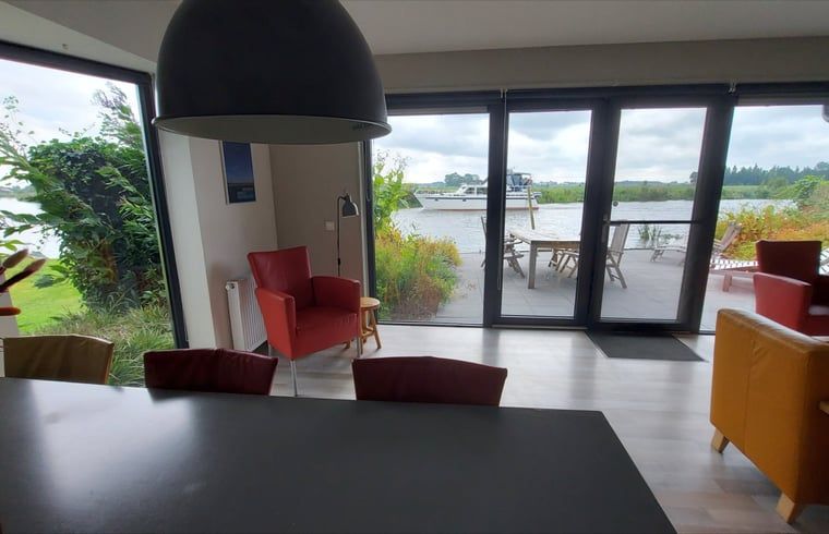 Indoor space overlooking the terrace at Cottage in Jannum near Dokkum, located in Friesland.