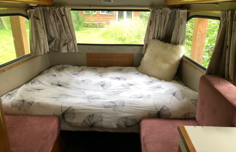 Cozy bedroom in Holiday home in Dreumel, located in the green River region of Gelderland, overlooking the garden.