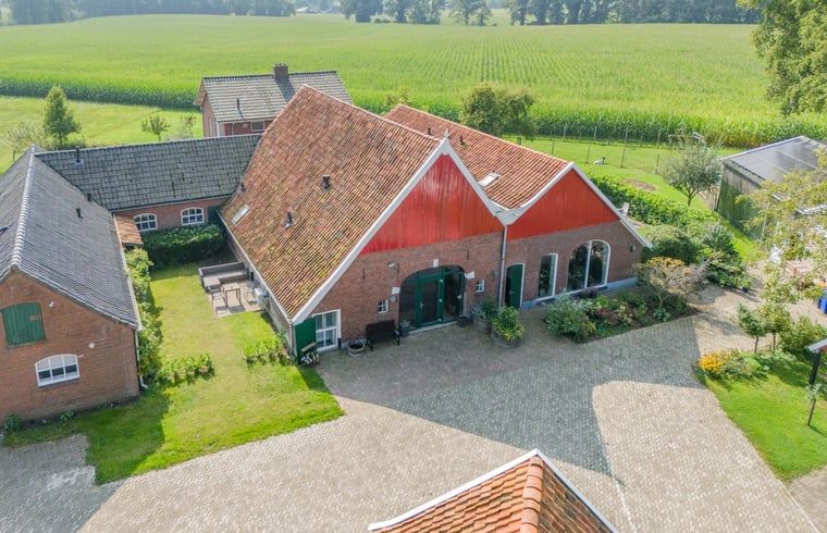 Huisje in Aalten, vakantiehuis in de Achterhoek met rustiek boerderijontwerp en groene omgeving in Gelderland.