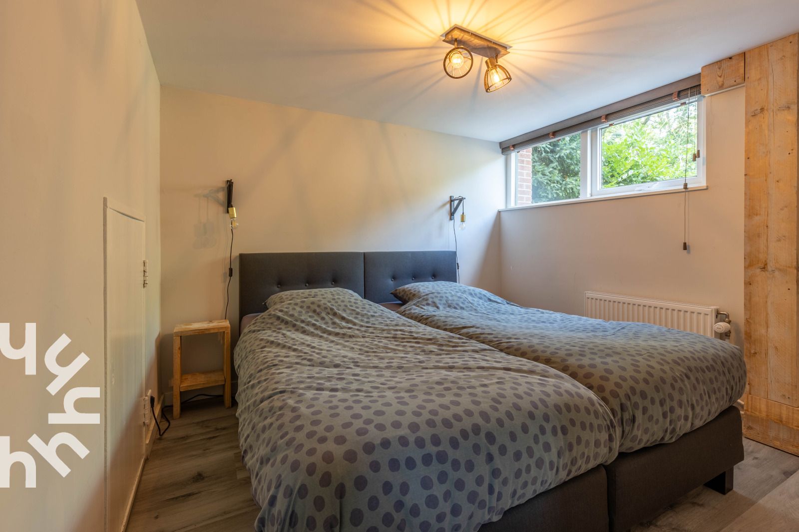 Luchtfoto van vakantiehuis DG994 in Aalten, omgeven door groen en velden.