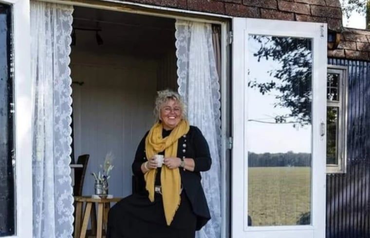 Wooden bucket with flowers in Holiday home in Vragender, Achterhoek, Gelderland. Natural decoration.