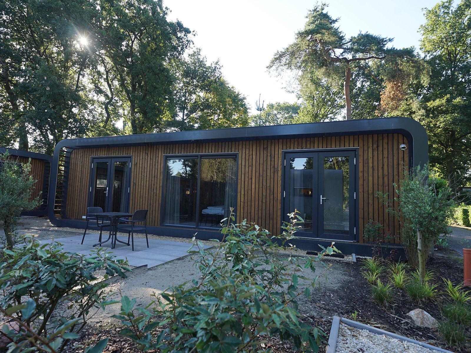 Chalet in Lochem with wooden exterior in the green surroundings of Achterhoek, Gelderland.