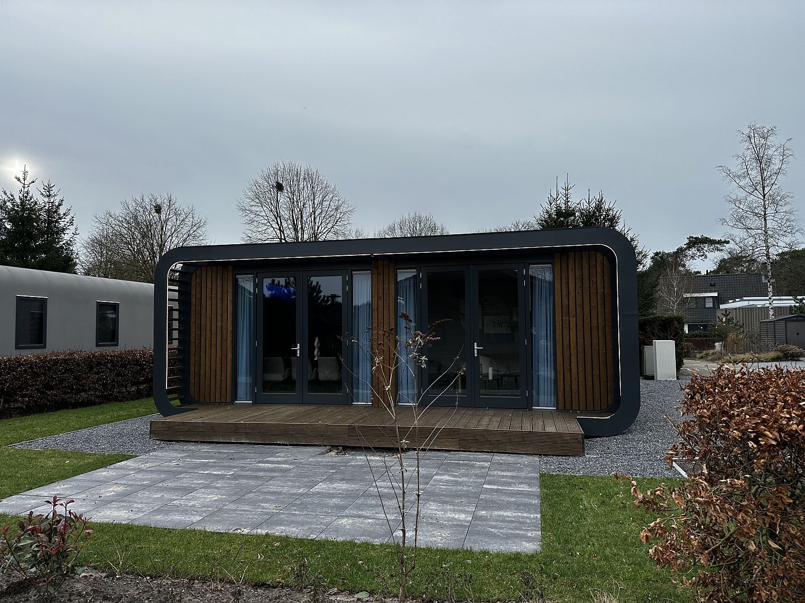Chalet in Lochem with modern wooden exterior, located in the rustic Achterhoek, Gelderland.