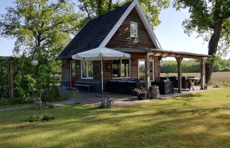 Zonnige veranda van Vakantiehuisje in Hengelo GLD, Varssel, Bronckhorst in de Achterhoek, Gelderland.