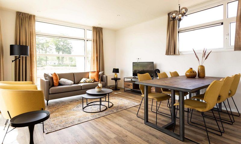 Cozy living room in Module Special 6 persons Wellness, Lichtenvoorde, with comfortable seating and lots of light.