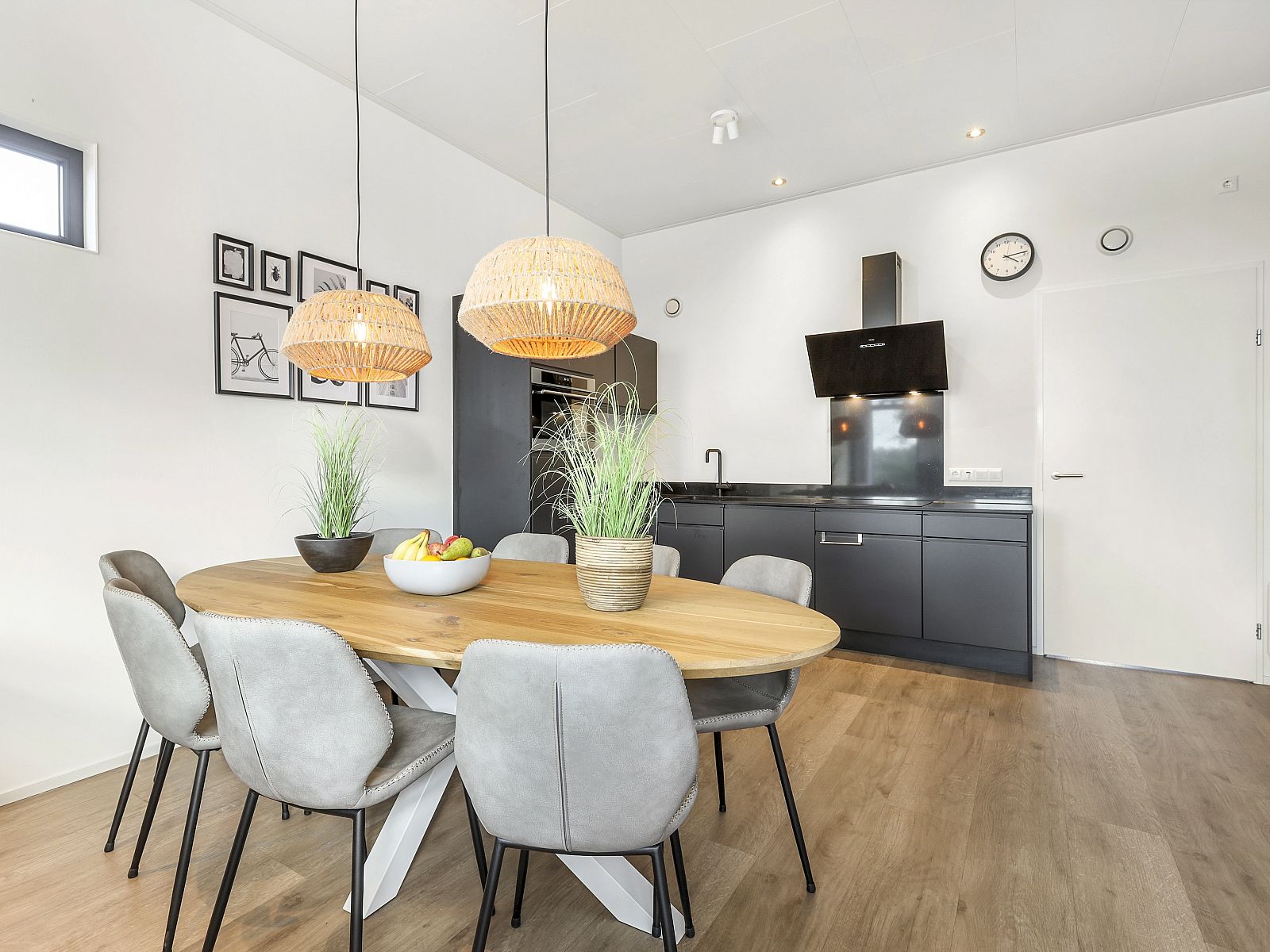 Dining area of De Vlinderhoeve vacation home in Kring van Dorth with stylish kitchen.