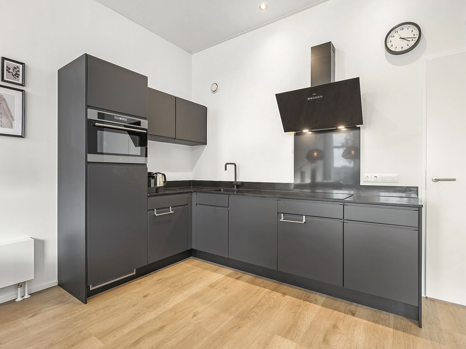 Modern kitchen in The Butterfly Farm 8-bed home with sleek decor.