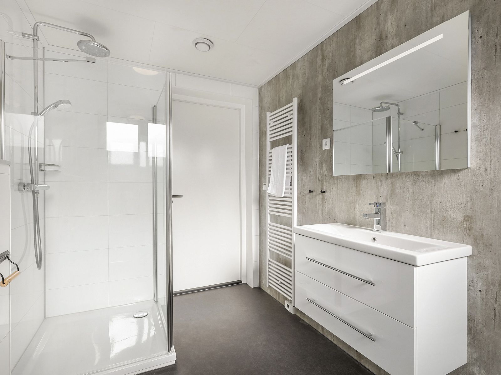 Comfortable bedroom in The Butterfly Farm 8-person house overlooking the garden.