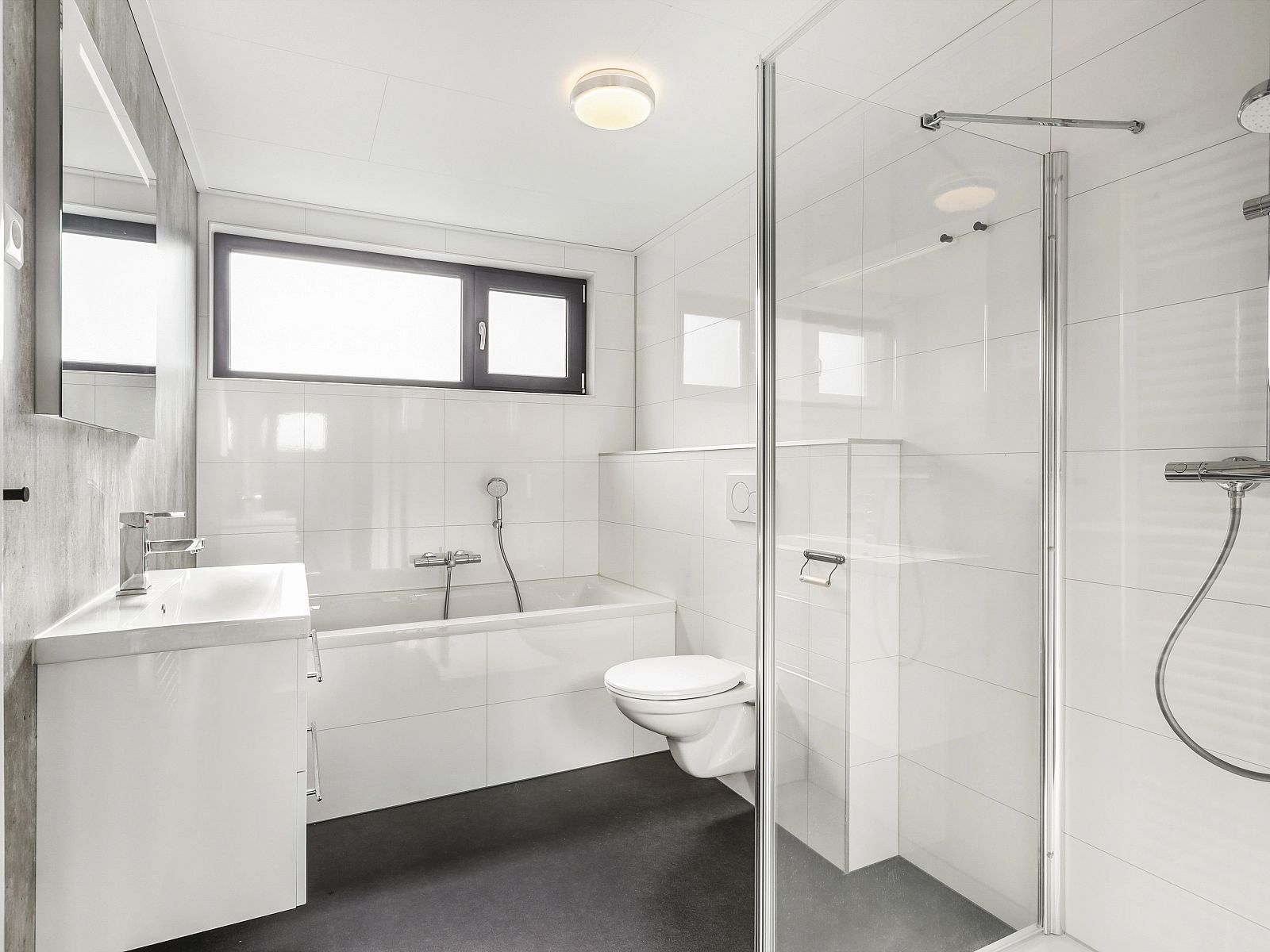 Luxury bedroom in The Butterfly Farm bungalow with modern art on the wall.