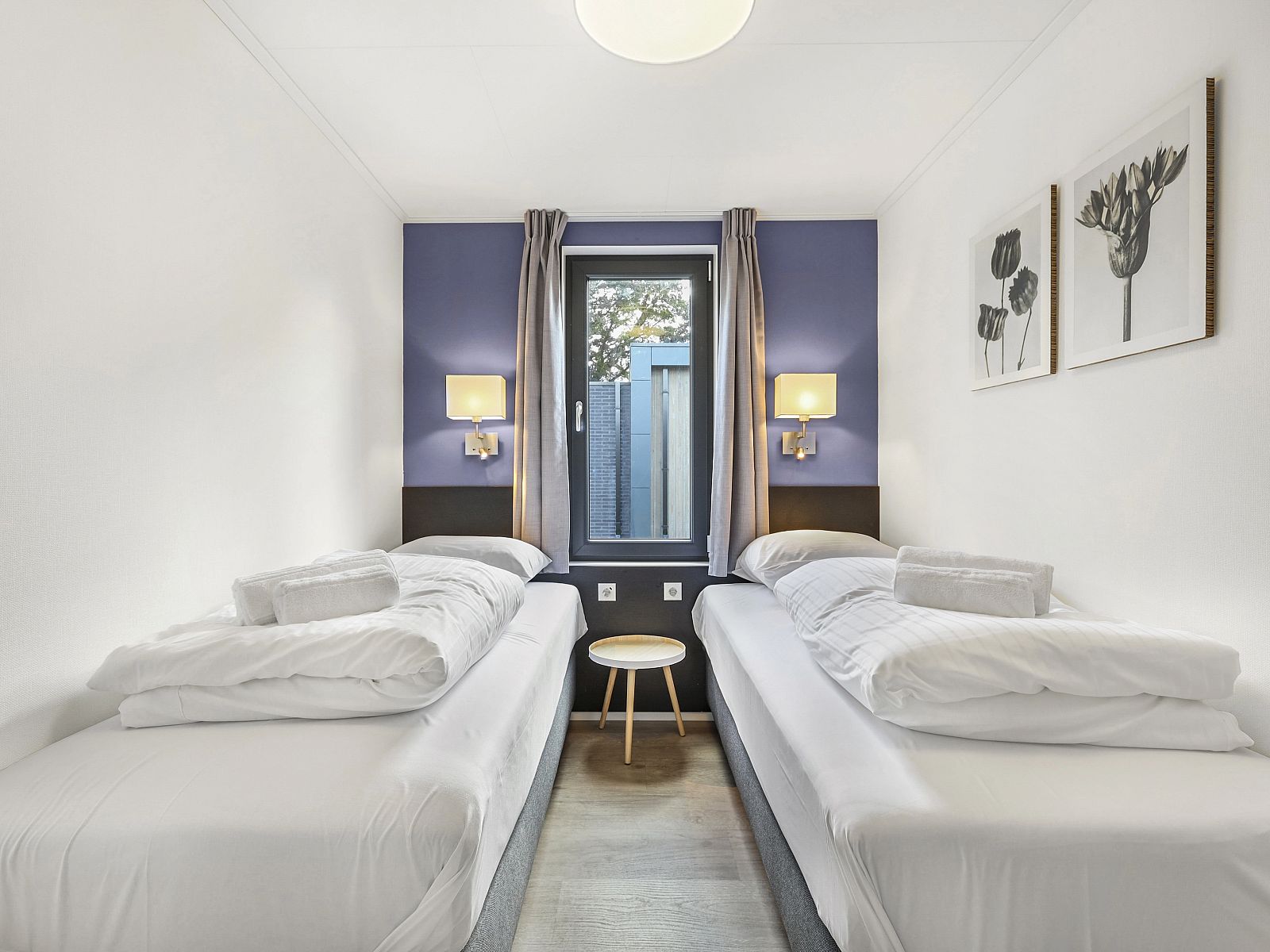 Second bedroom in The Butterfly Farm bungalow with comfortable double bed.