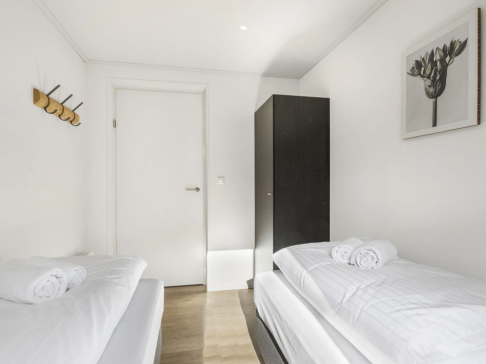 Modern bathroom in De Vlinderhoeve vacation home with glass shower wall.