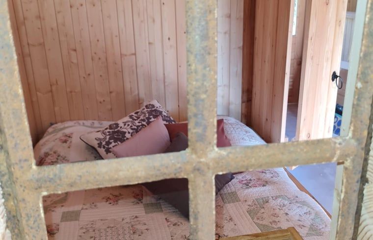 Cozy corner in the bedroom of Holiday home in Winterswijk Corle, Achterhoek, ideal for relaxation.