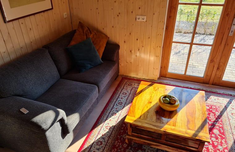 Comfortable living room in Holiday home in Winterswijk Corle, perfect for a relaxing stay in the Achterhoek.