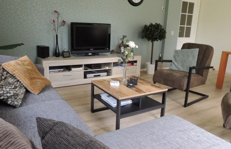 Cozy living room of Holiday Home in Winterswijk Corle, Achterhoek, with comfortable seating area and modern furnishings.