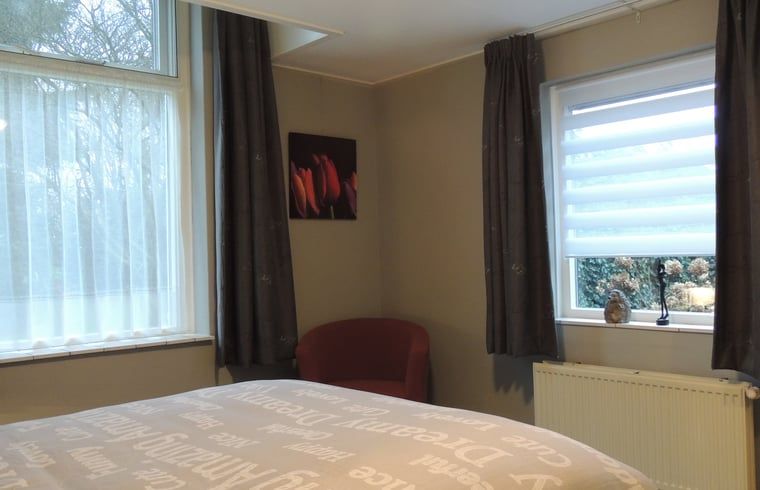 Cozy bedroom in Holiday Home in Winterswijk Corle, located in Achterhoek, Gelderland, overlooking the serene nature.