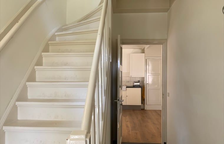 Staircase of Holiday Home in Corle, Winterswijk Corle, overlooking kitchen, ideal for a relaxing stay.